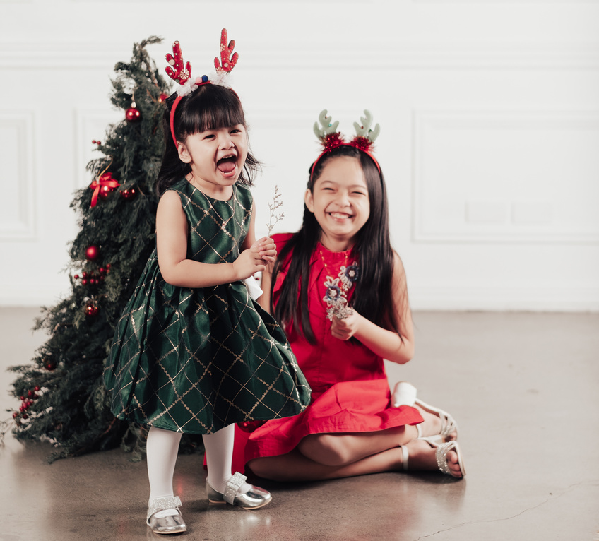 Sisters Decorating Christmas Tree